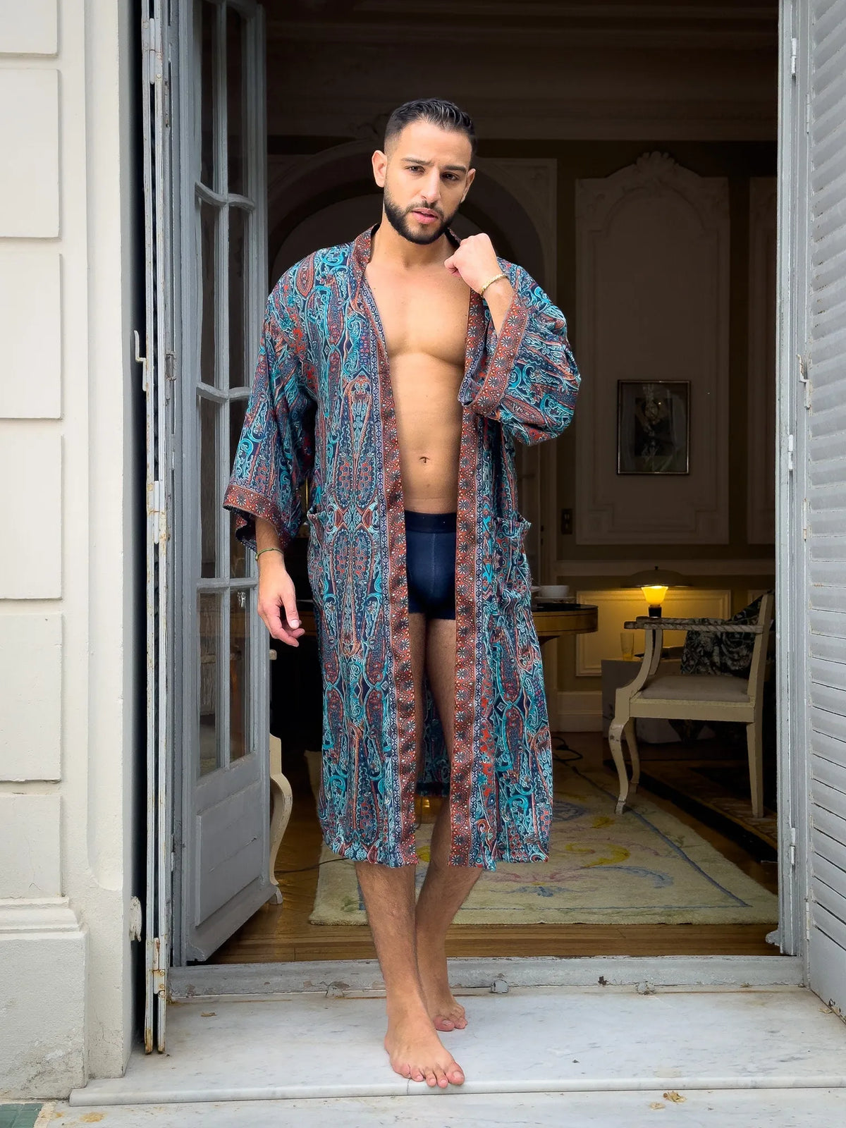 Men’s kimono worn open in a doorway