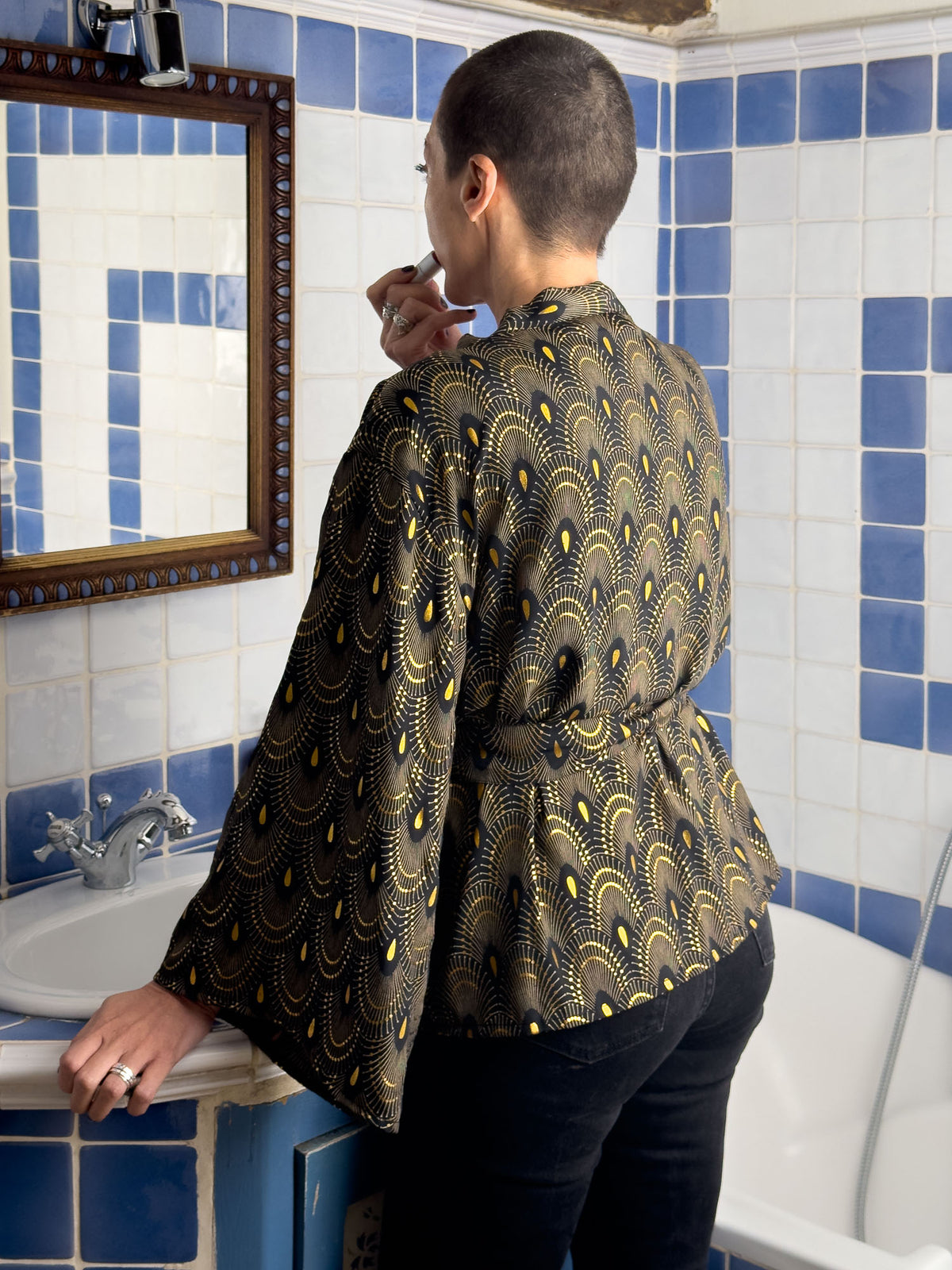 Back view of the belted black silk-blend kimono jacket