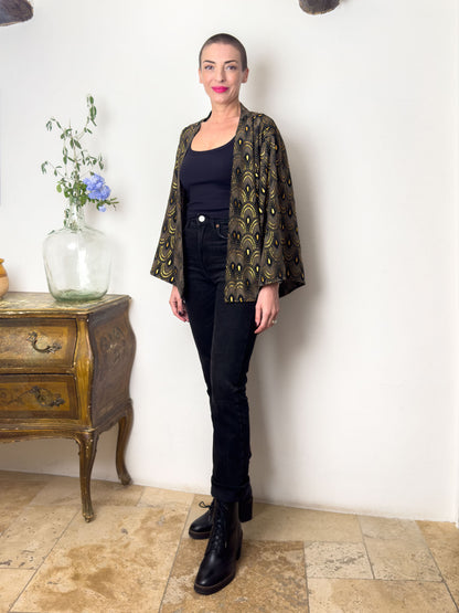 Black printed silk-blend kimono jacket worn open, three-quarter view